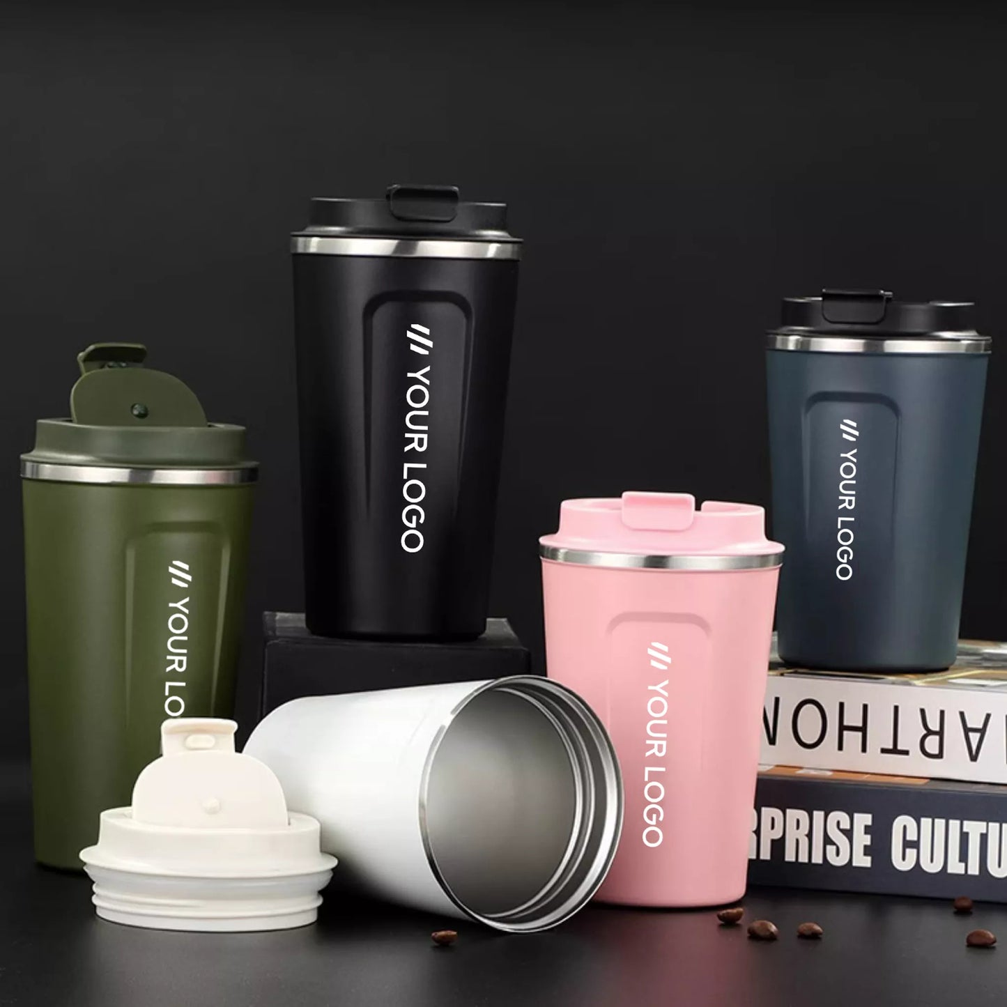 Collection of branded stainless steel tumblers on a dark background